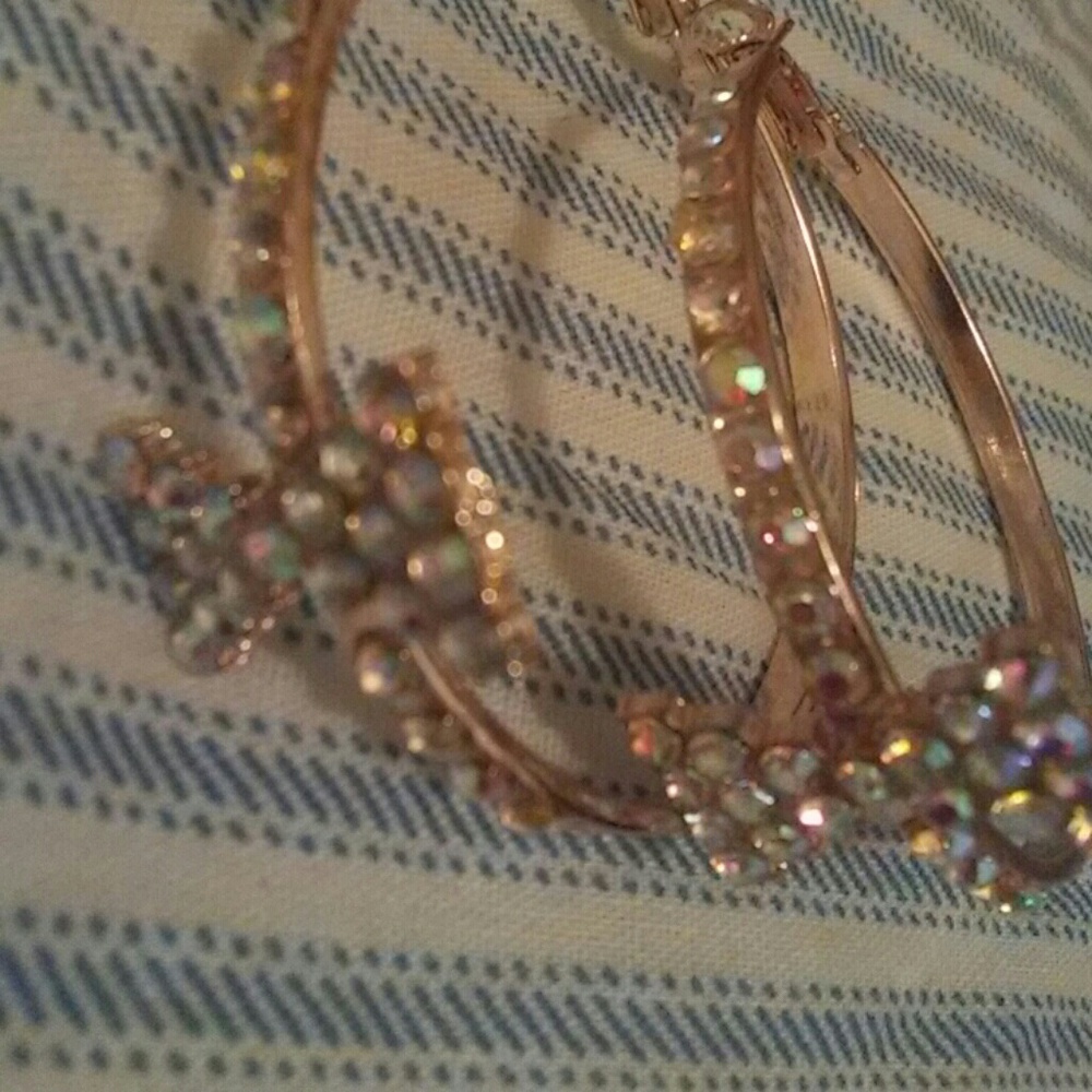 Rose gold hoop earrings with a bow